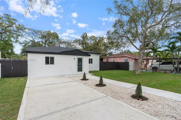 a house view with a garden space