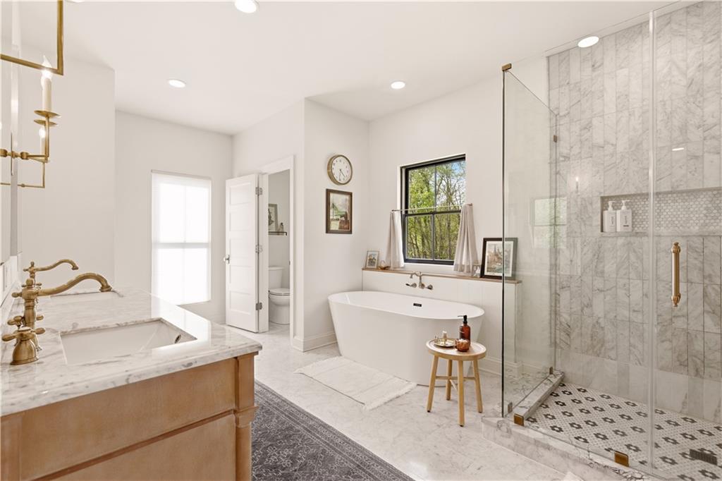 315 Stewarton Road Mill Run, PA 15464 - Photo 25 of 47 a spacious bathroom with a granite countertop sink a mirror and a shower