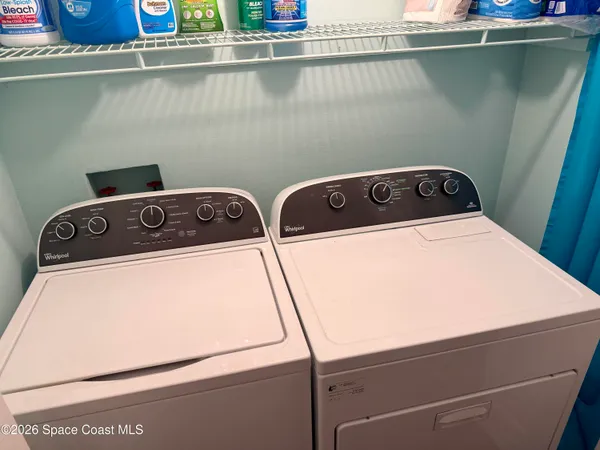 a utility room with dryer and washer