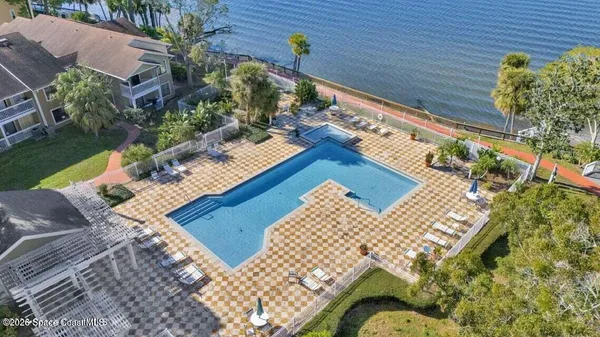 a room with gym equipment and windows
