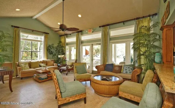 an aerial view of a house with a lake view