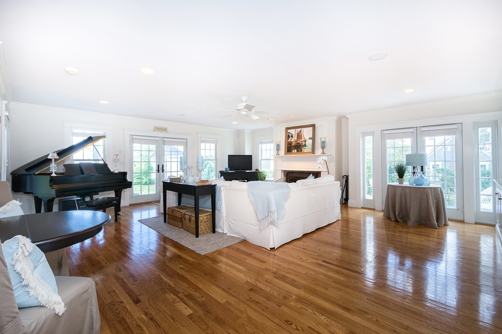 160 Edward Foster Road Scituate, MA 02066 - Photo 11 of 30 a living room with fireplace furniture and a wooden floor