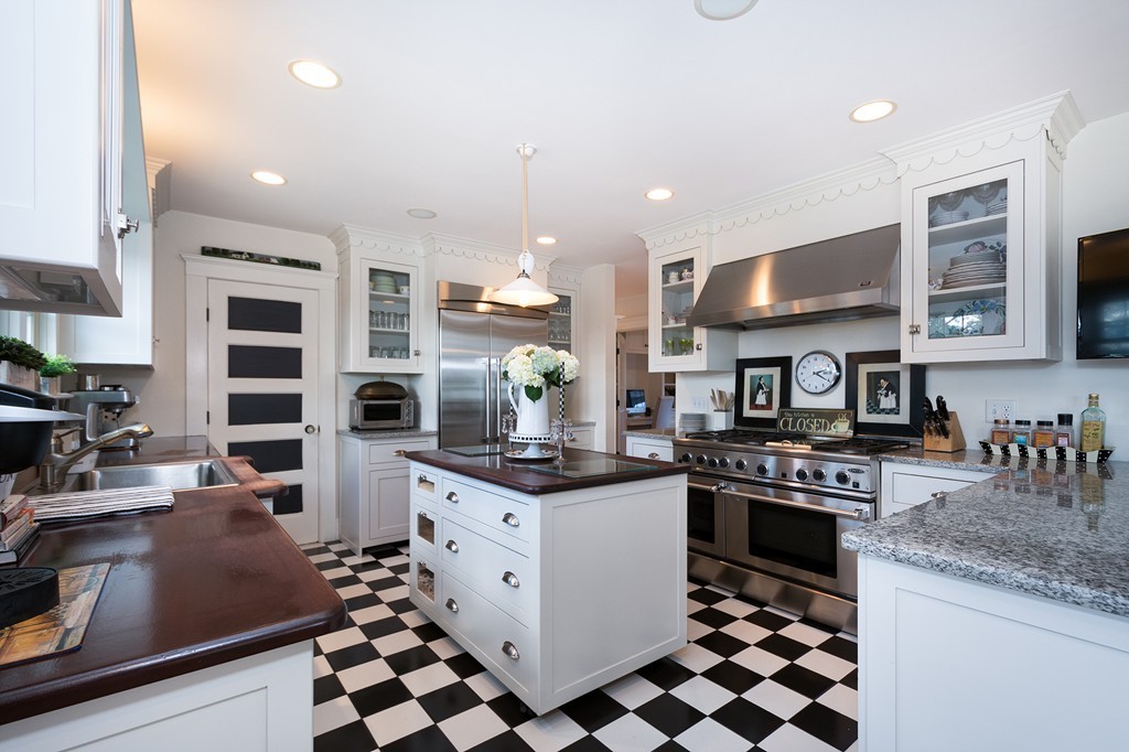 160 Edward Foster Road Scituate, MA 02066 - Photo 17 of 30 a kitchen with stainless steel appliances kitchen island granite countertop a sink and cabinets