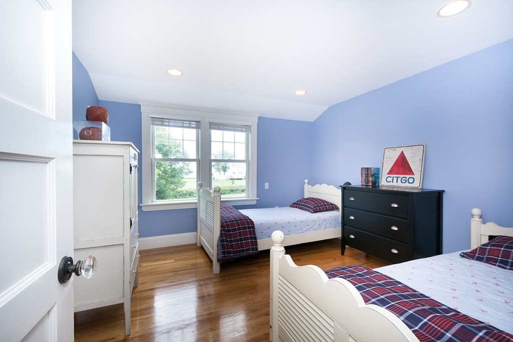 160 Edward Foster Road Scituate, MA 02066 - Photo 26 of 30 a bedroom with a bed and wooden floor