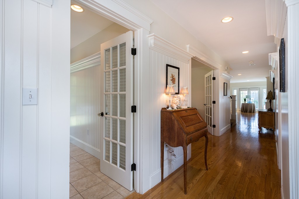 160 Edward Foster Road Scituate, MA 02066 - Photo 6 of 30 a view of a hallway with wooden floor and furniture
