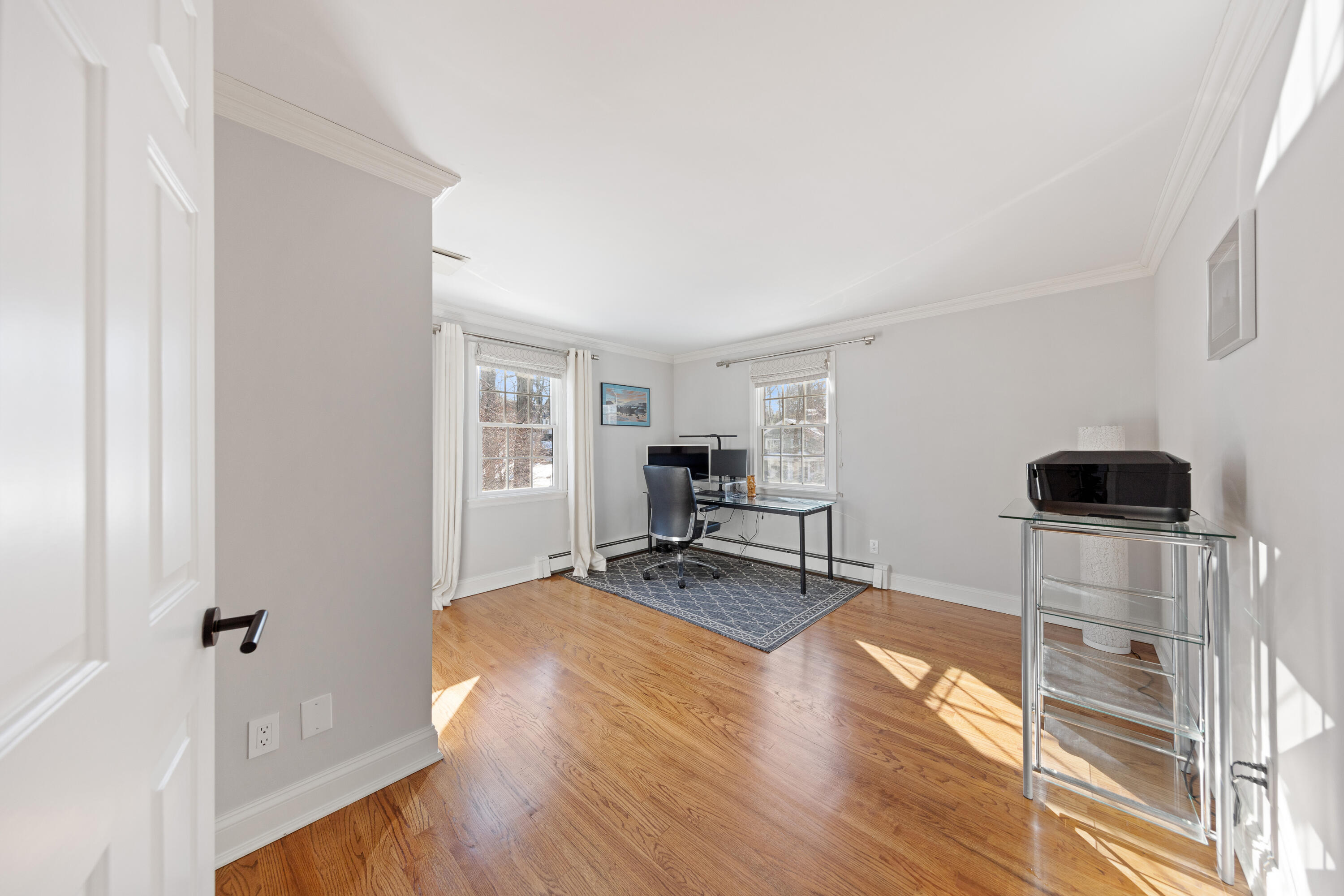 10 Chasmars Pond Road Darien, CT 06820 - Photo 22 of 32 a living room with furniture and a wooden floor
