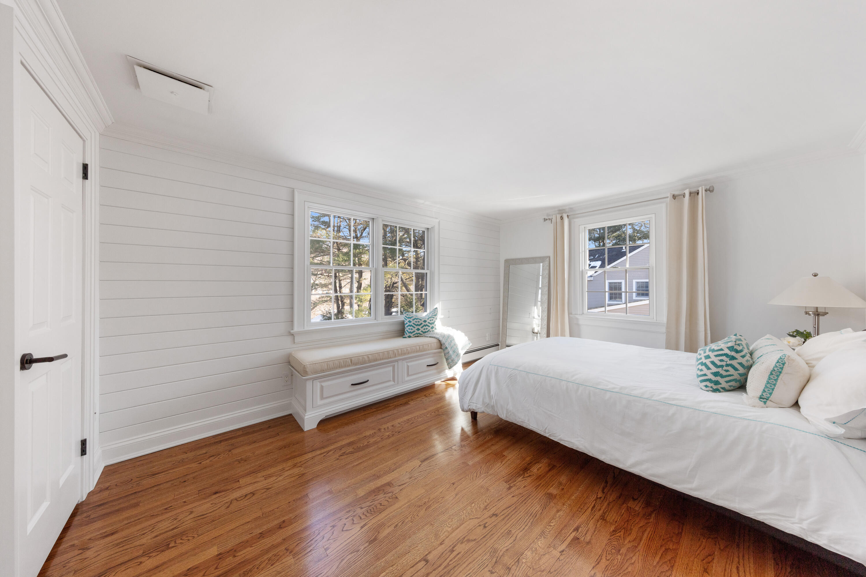 10 Chasmars Pond Road Darien, CT 06820 - Photo 23 of 32 a bedroom with a bed and a window