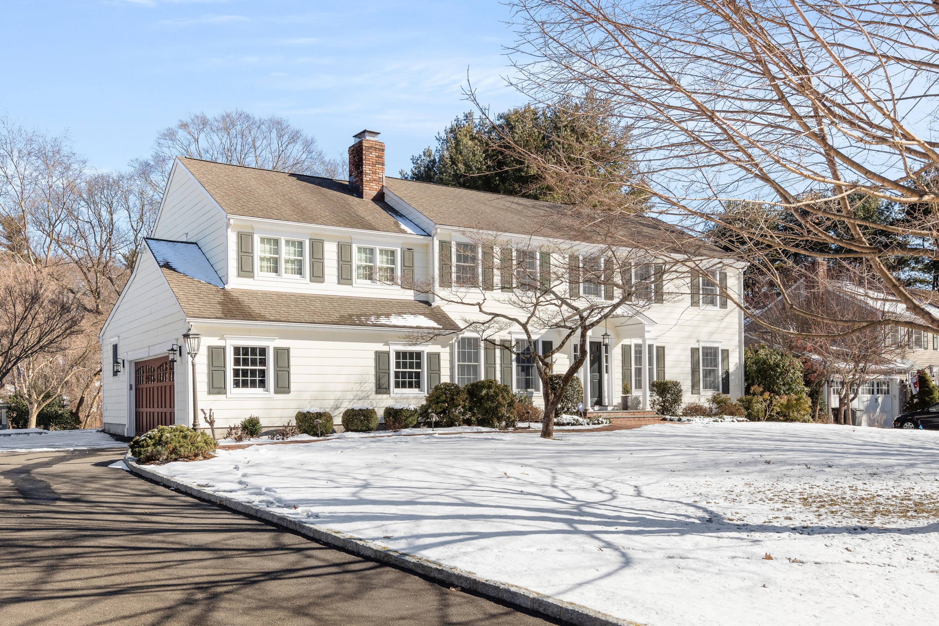 10 Chasmars Pond Road Darien, CT 06820 - Photo 26 of 32 a view of a white house with a outdoor space