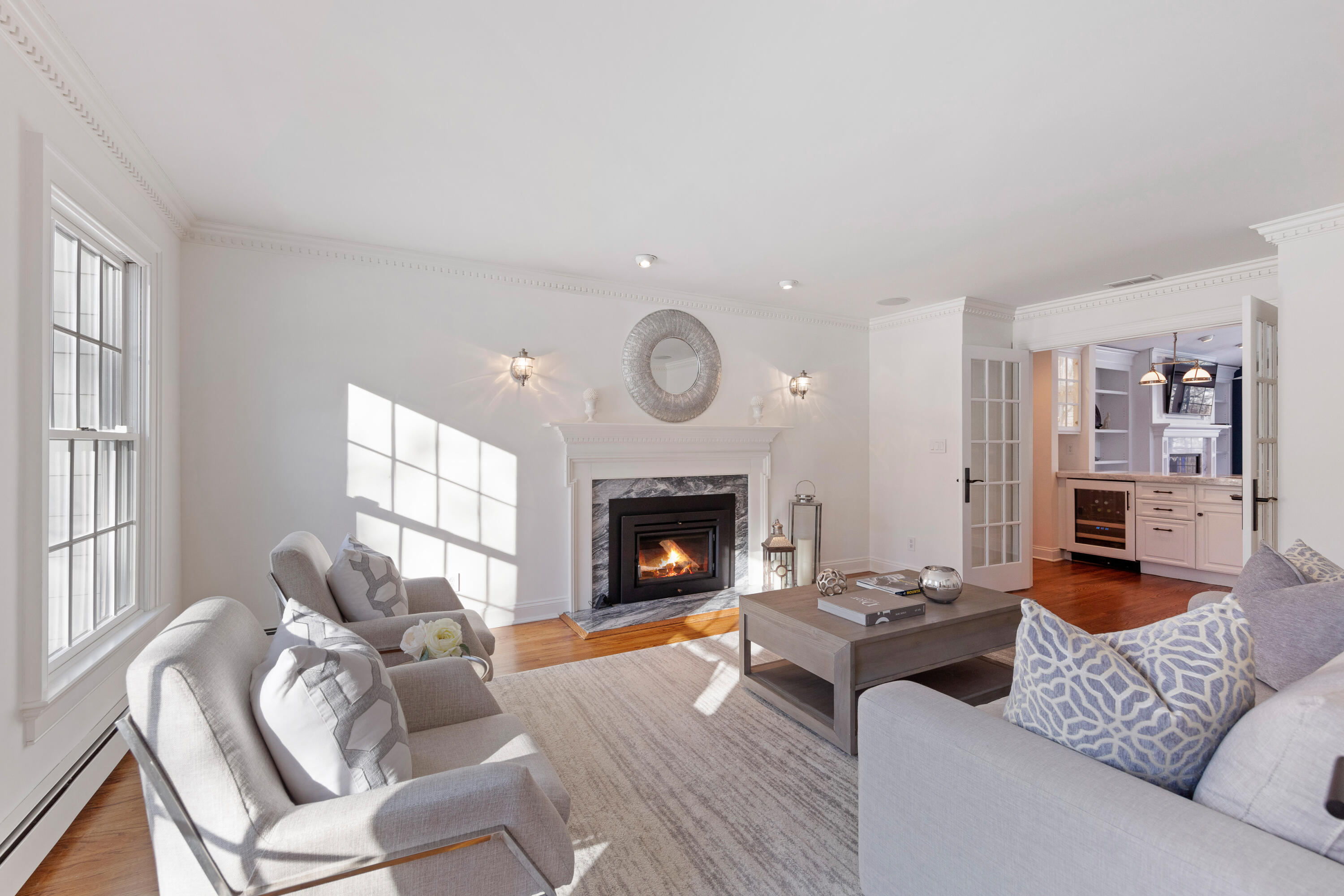 10 Chasmars Pond Road Darien, CT 06820 - Photo 3 of 32 a living room with furniture and a fireplace