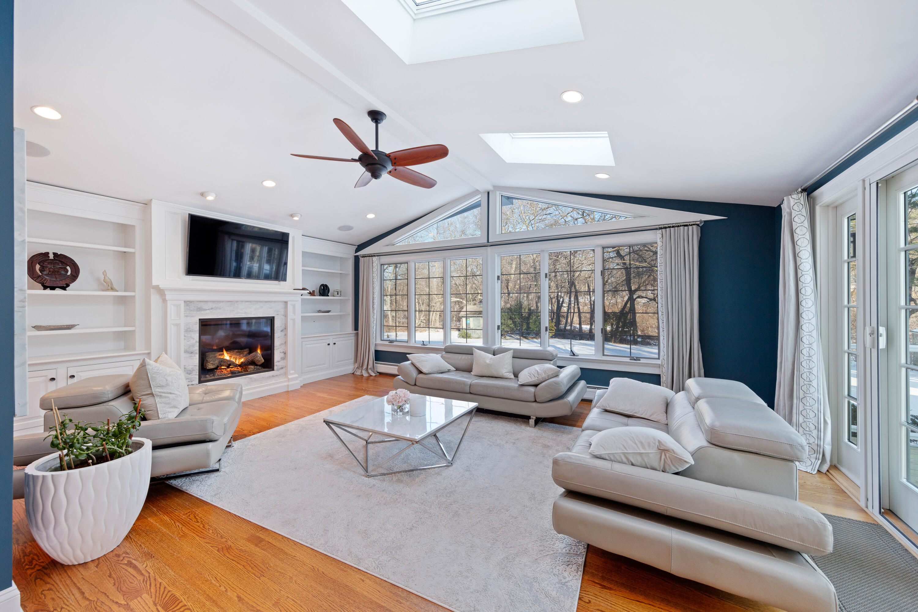 10 Chasmars Pond Road Darien, CT 06820 - Photo 5 of 32 a living room with furniture large window and fireplace