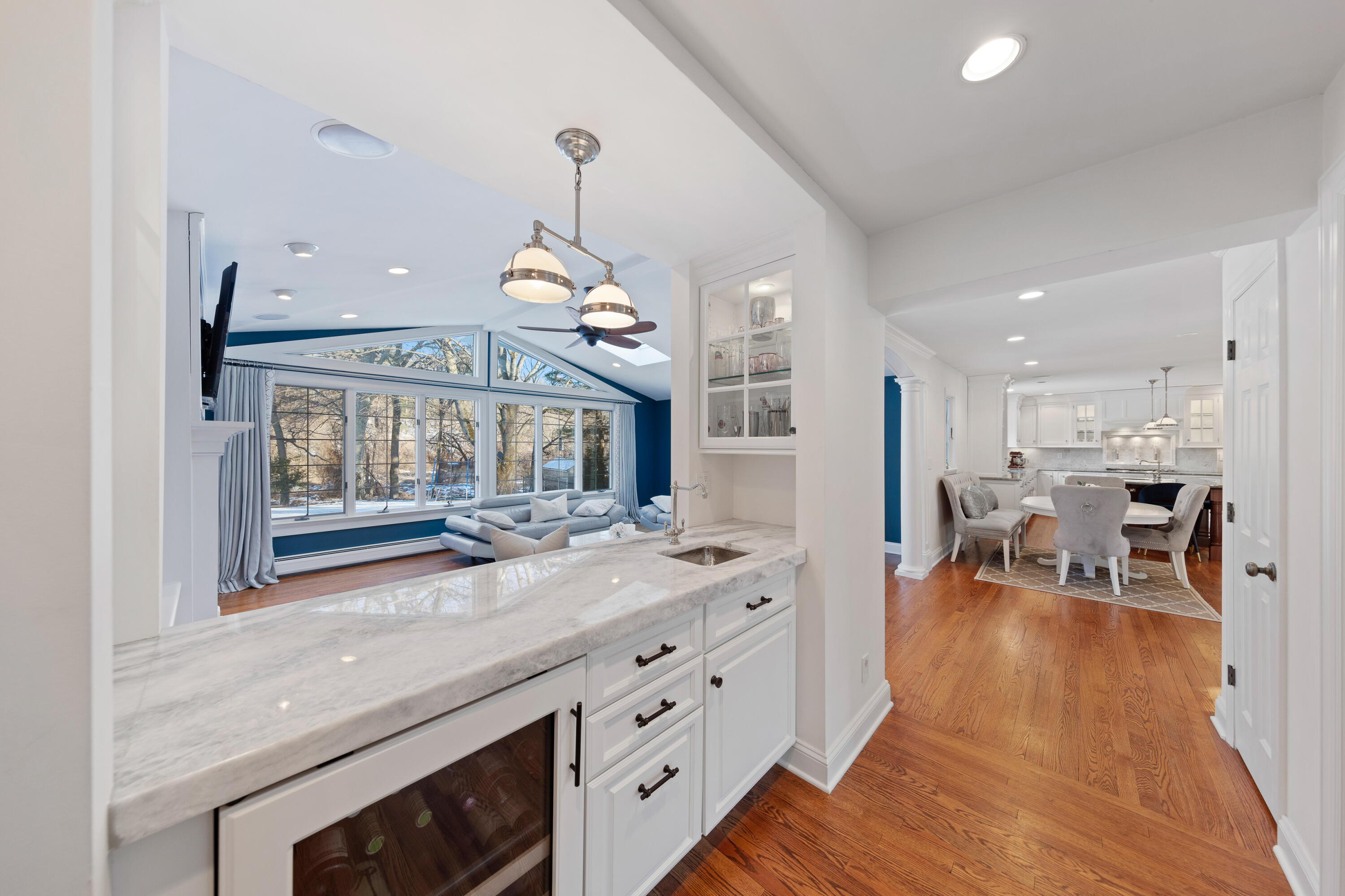 10 Chasmars Pond Road Darien, CT 06820 - Photo 7 of 32 a view of living room kitchen with granite countertop stainless steel appliances and wooden floor