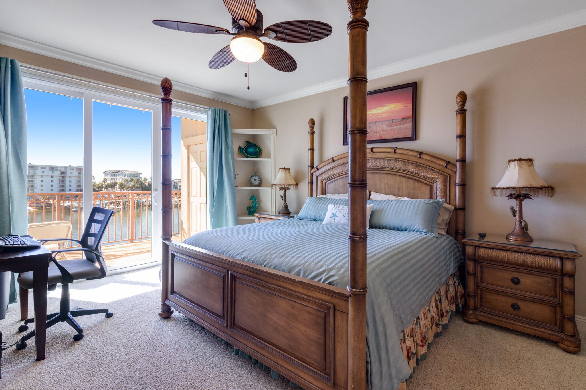 724 Harbor Boulevard, Unit 201 Destin, FL 32541 - Photo 11 of 25 a bed room with a bed and a chair