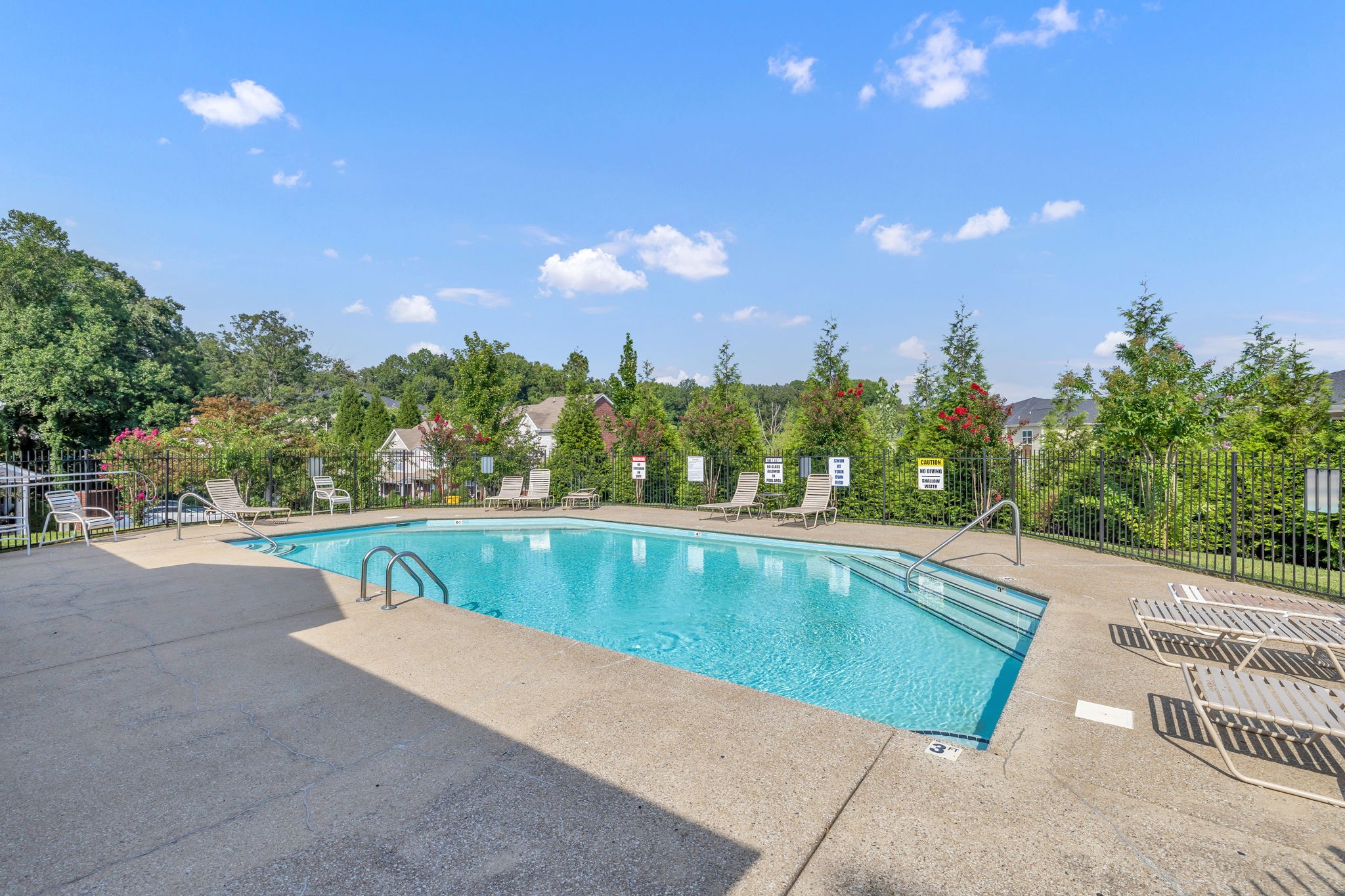 7334 Planters Road Fairview, TN 37062 - Photo 29 of 30 a view of a swimming pool with an outdoor seating and a palm tree