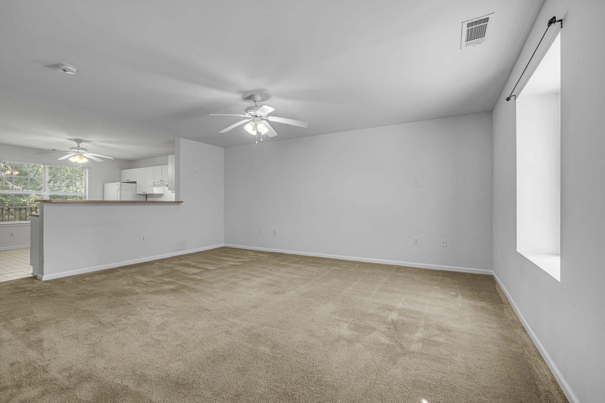 7334 Planters Road Fairview, TN 37062 - Photo 5 of 30 wooden floor in an empty room with a window