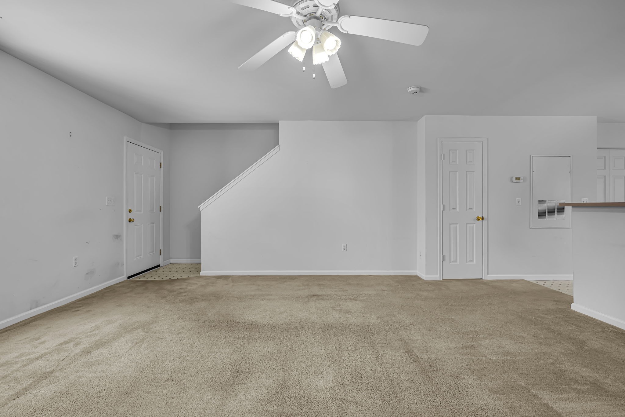 7334 Planters Road Fairview, TN 37062 - Photo 9 of 30 a view of an empty room with a ceiling fan and window