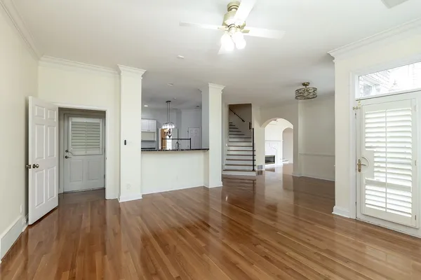 a kitchen with a refrigerator and white cabinets
