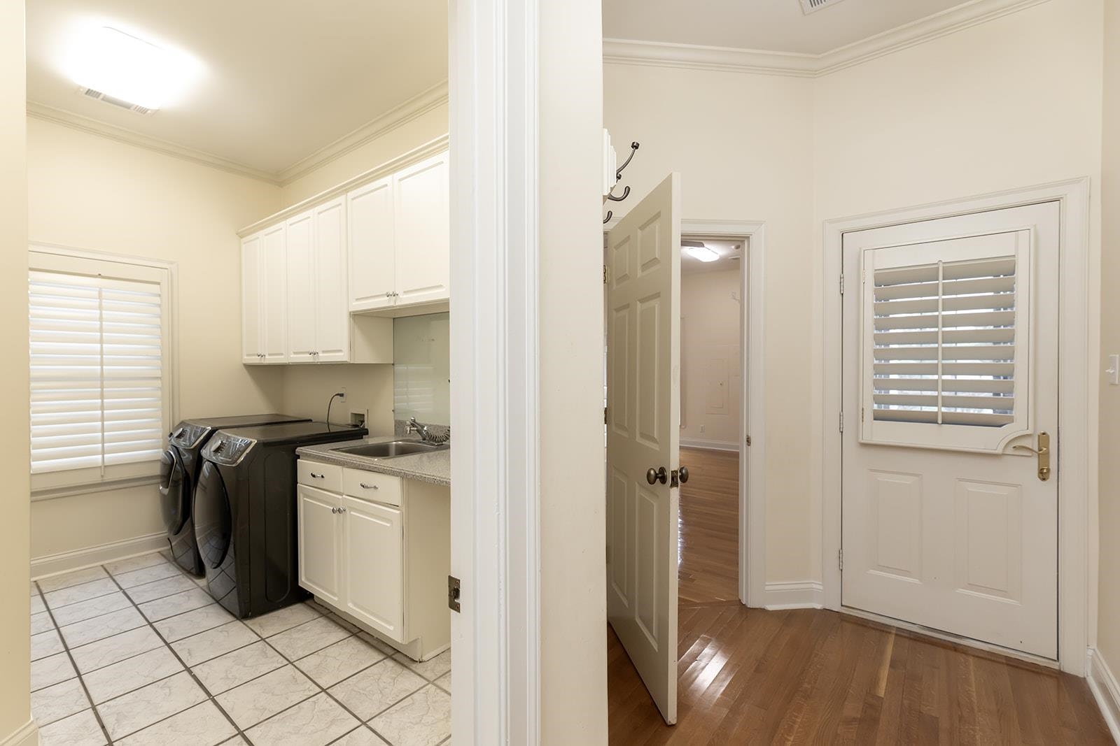 9390 Mayfield Road South Collierville, TN 38017 - Photo 18 of 40 a kitchen with a refrigerator and white cabinets