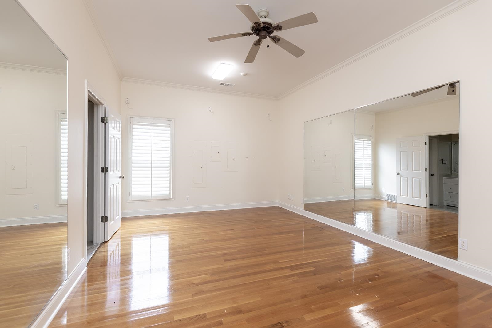 9390 Mayfield Road South Collierville, TN 38017 - Photo 19 of 40 a view of empty room with wooden floor and fan