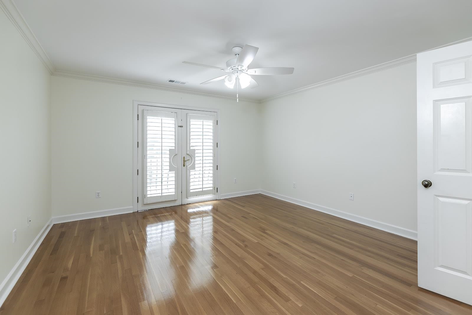 9390 Mayfield Road South Collierville, TN 38017 - Photo 29 of 40 a view of an empty room with wooden floor and a window
