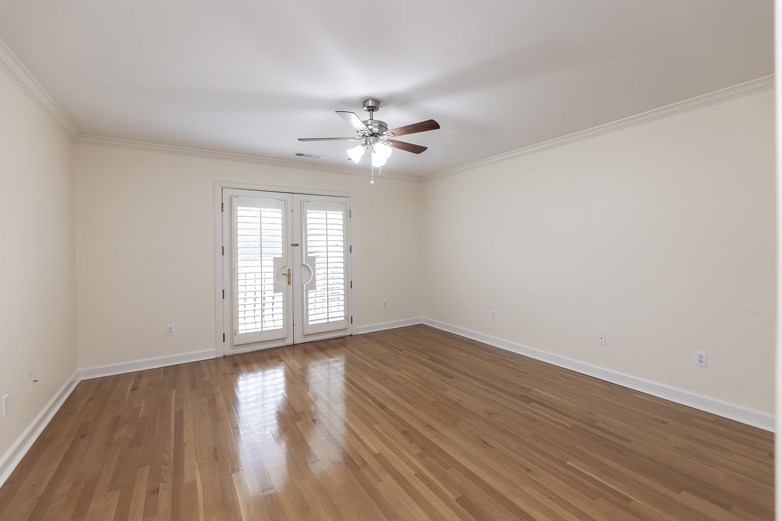 9390 Mayfield Road South Collierville, TN 38017 - Photo 34 of 40 a view of an empty room with wooden floor and a window