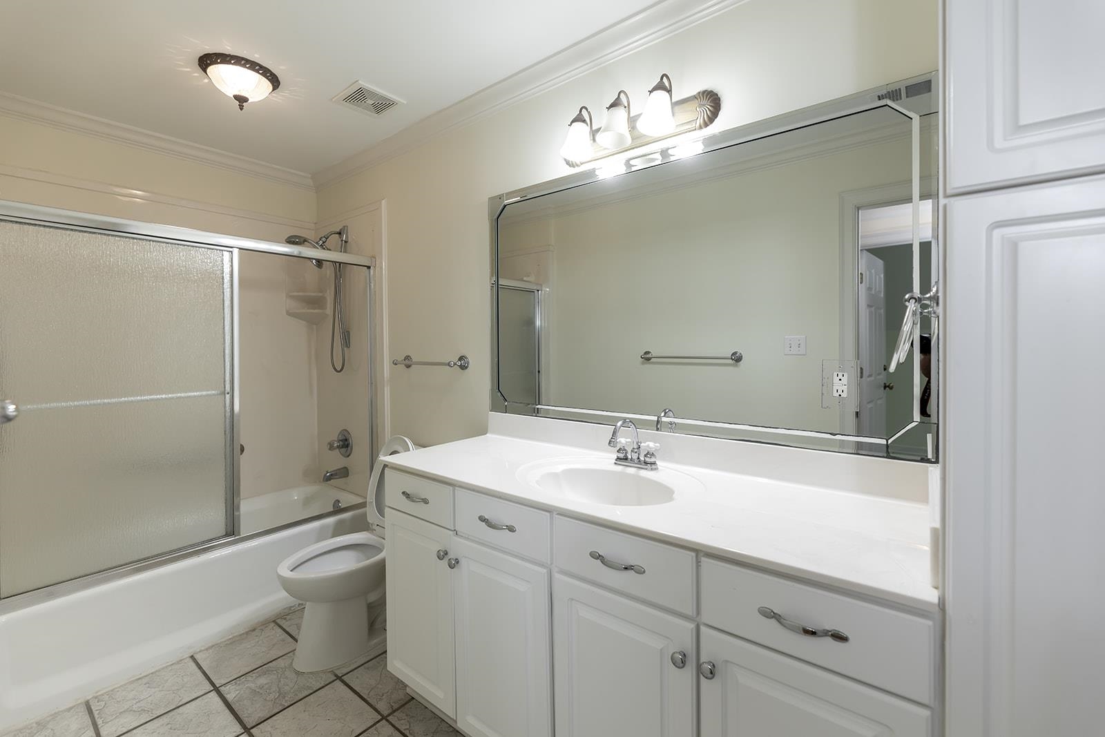 9390 Mayfield Road South Collierville, TN 38017 - Photo 35 of 40 a bathroom with a sink a toilet and shower