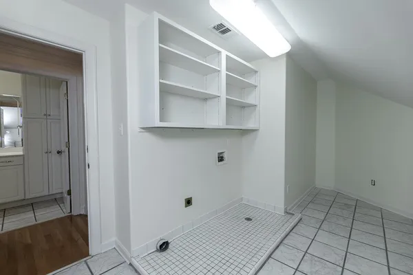 a view of a kitchen with a sink and a window