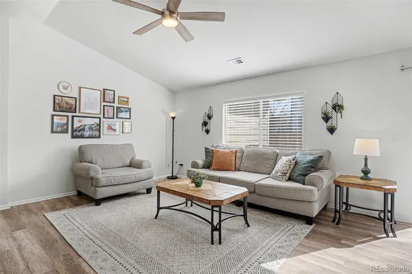 a living room with furniture and a window