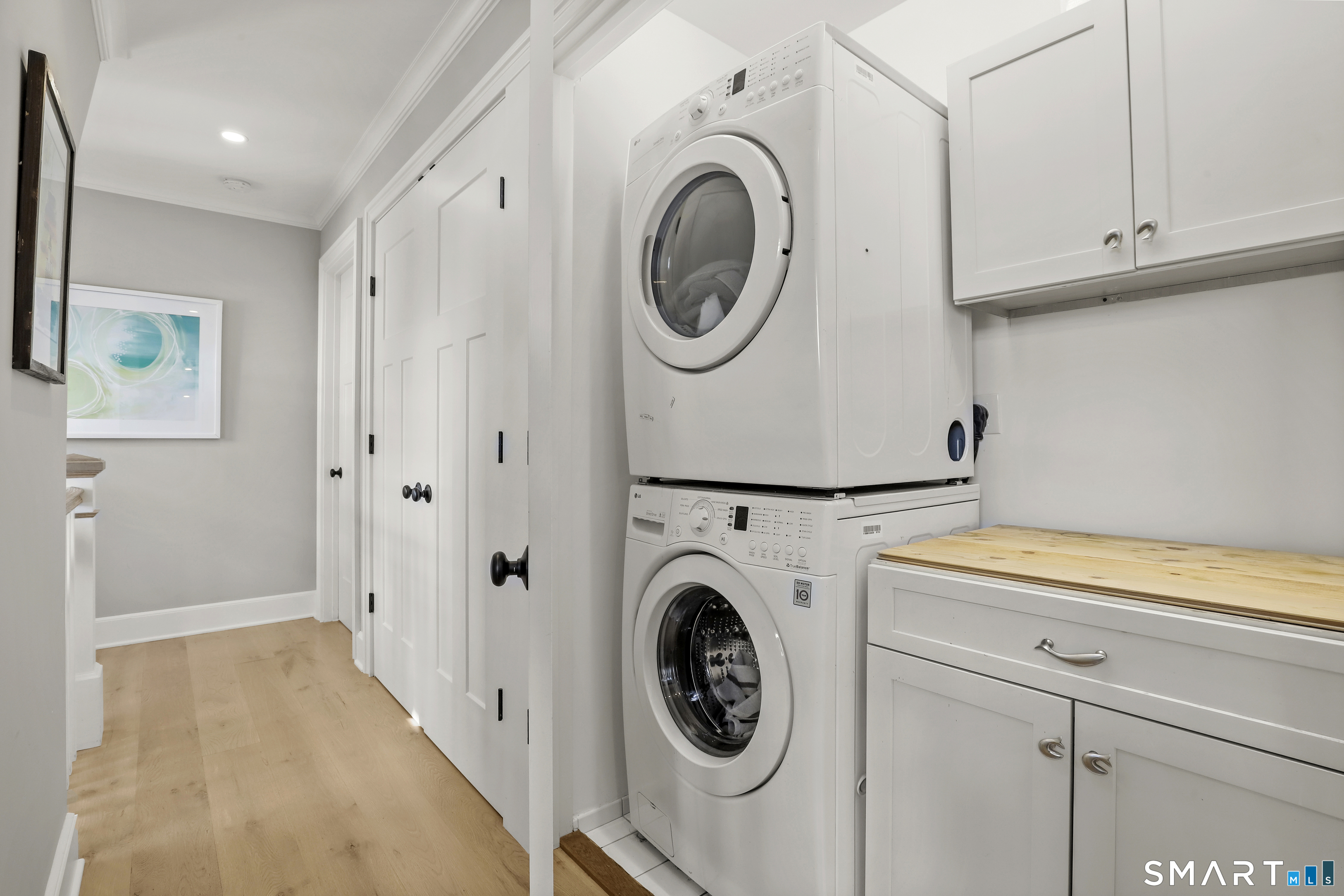 75 Craig Court Fairfield, CT 06824 - Photo 24 of 35 Laundry on the second floor with convenient work space