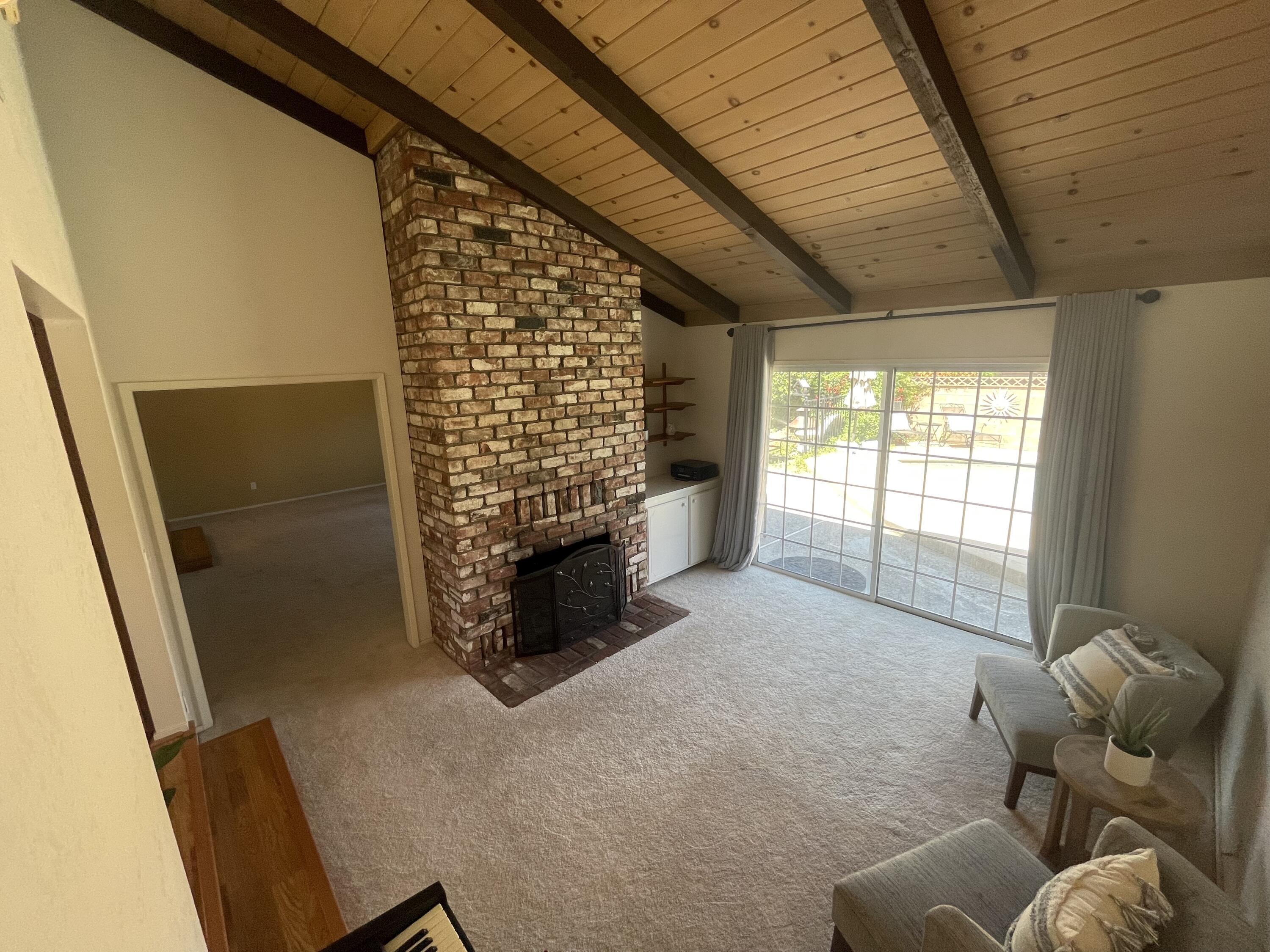 4170 Meander Drive Redding, CA 96001 - Photo 15 of 50 a living room with furniture and a fireplace