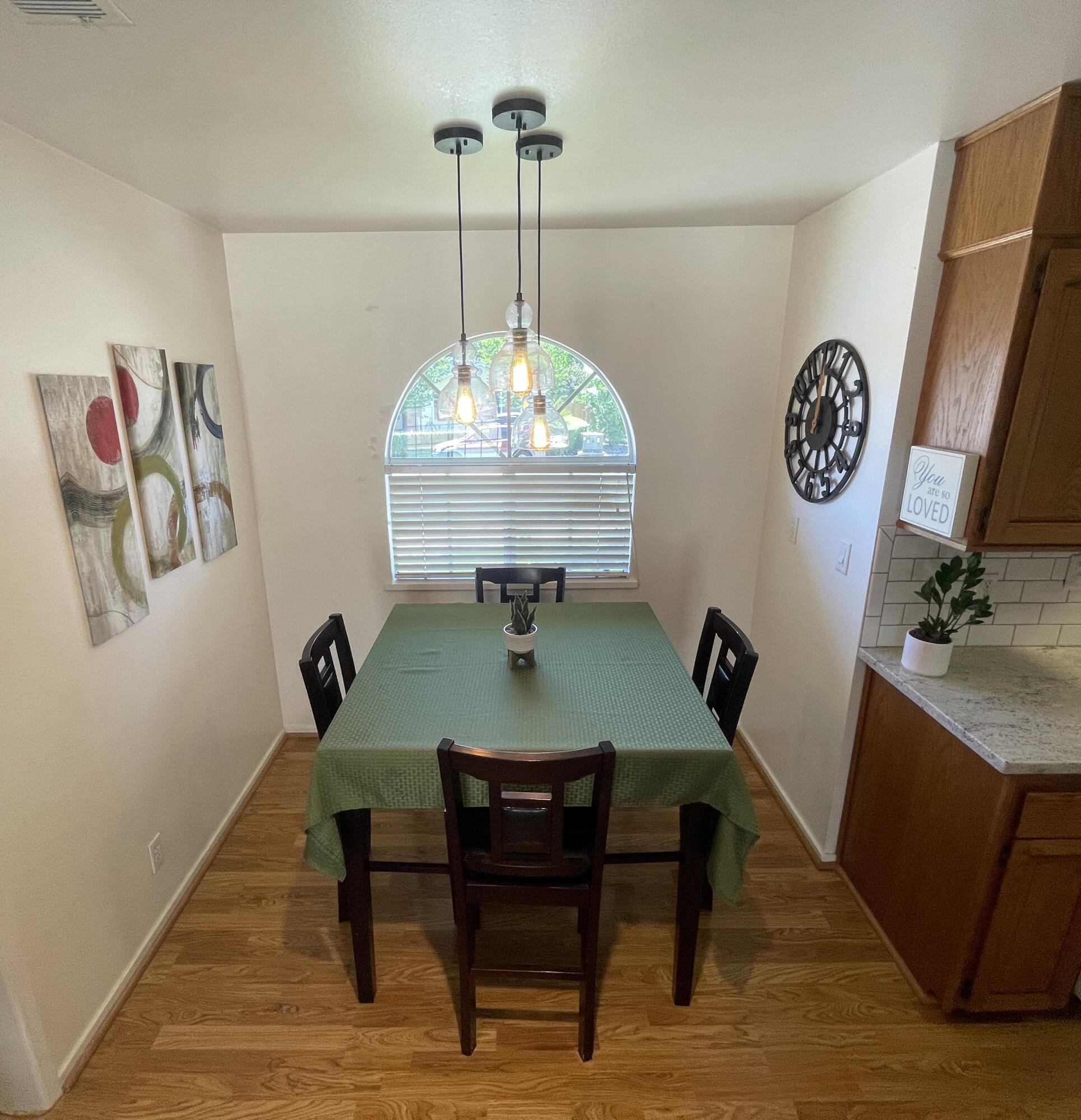 4170 Meander Drive Redding, CA 96001 - Photo 17 of 50 a view of a dining room with furniture and wooden floor