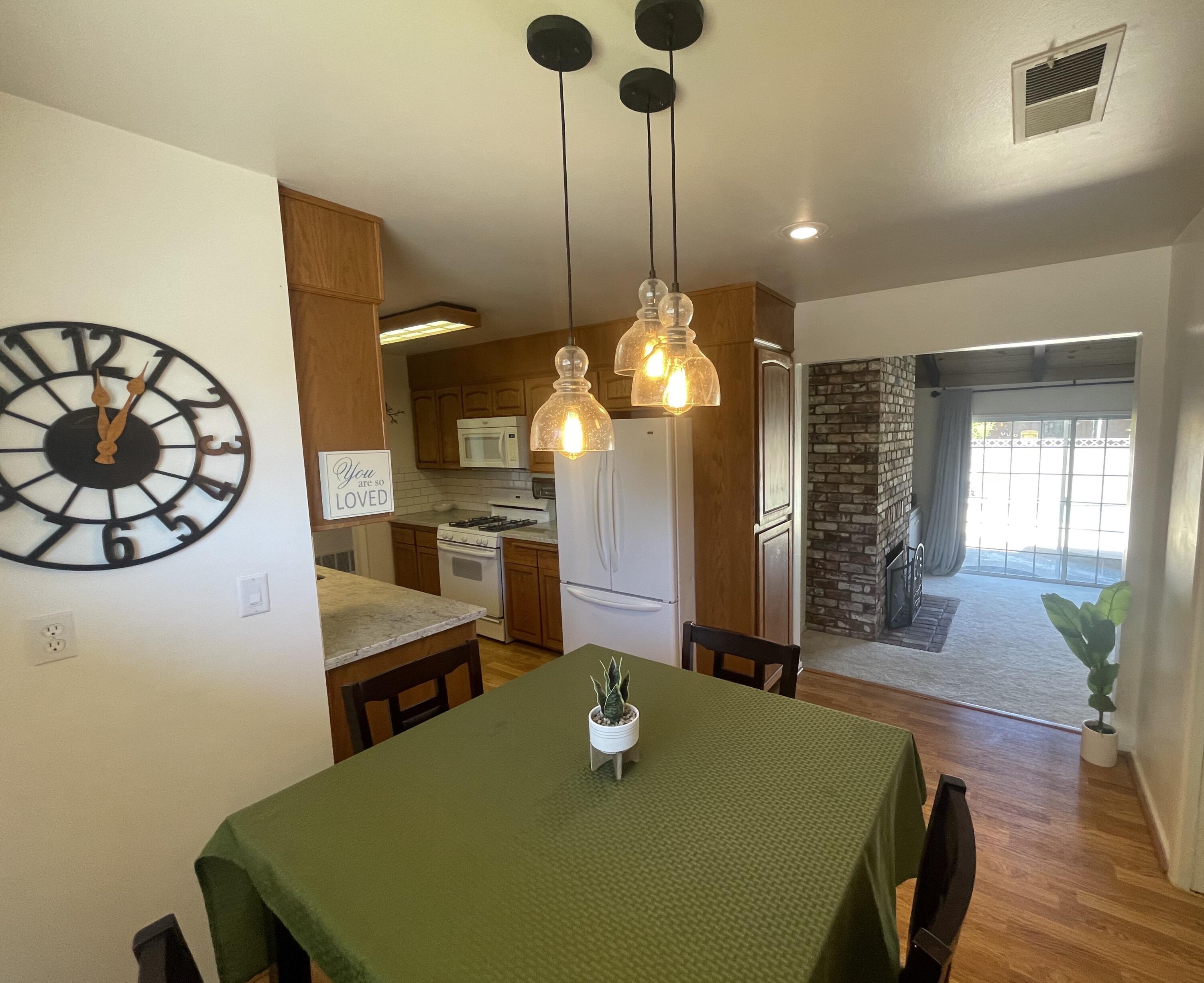4170 Meander Drive Redding, CA 96001 - Photo 18 of 50 a view of a dining room with furniture and wooden floor