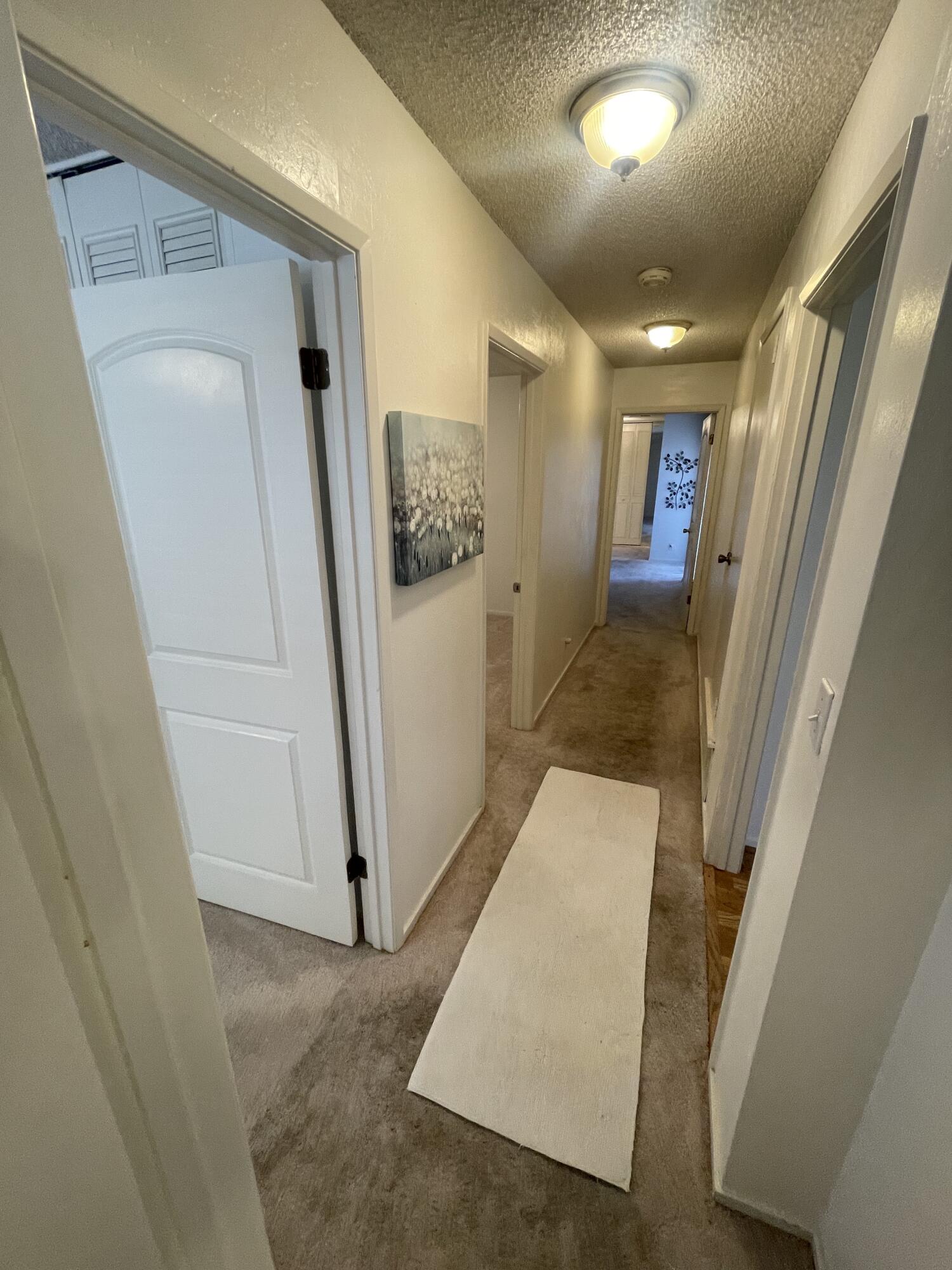 4170 Meander Drive Redding, CA 96001 - Photo 24 of 50 a view of a hallway with wooden floor and entryway