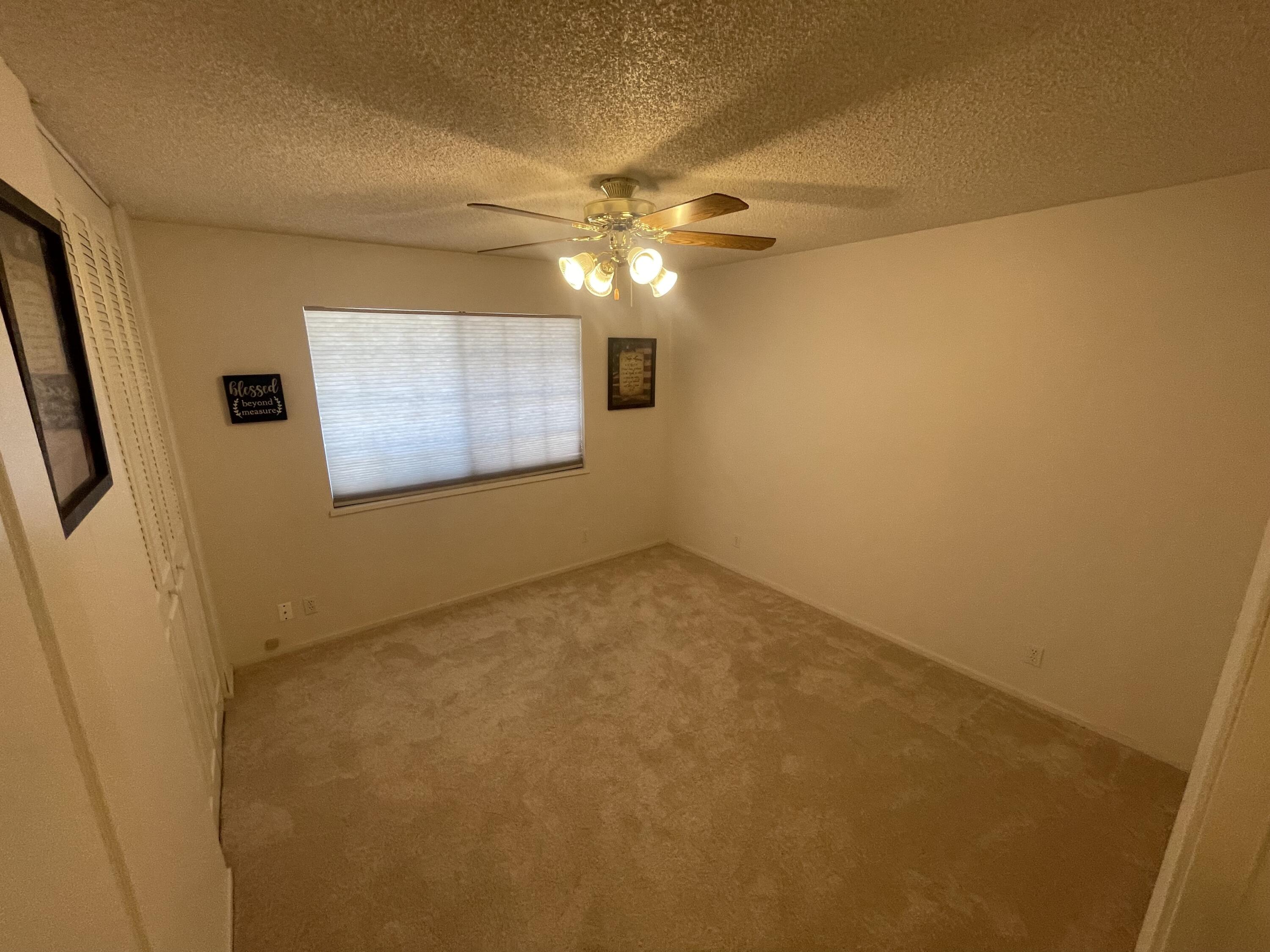 4170 Meander Drive Redding, CA 96001 - Photo 30 of 50 en empty room with windows and fan