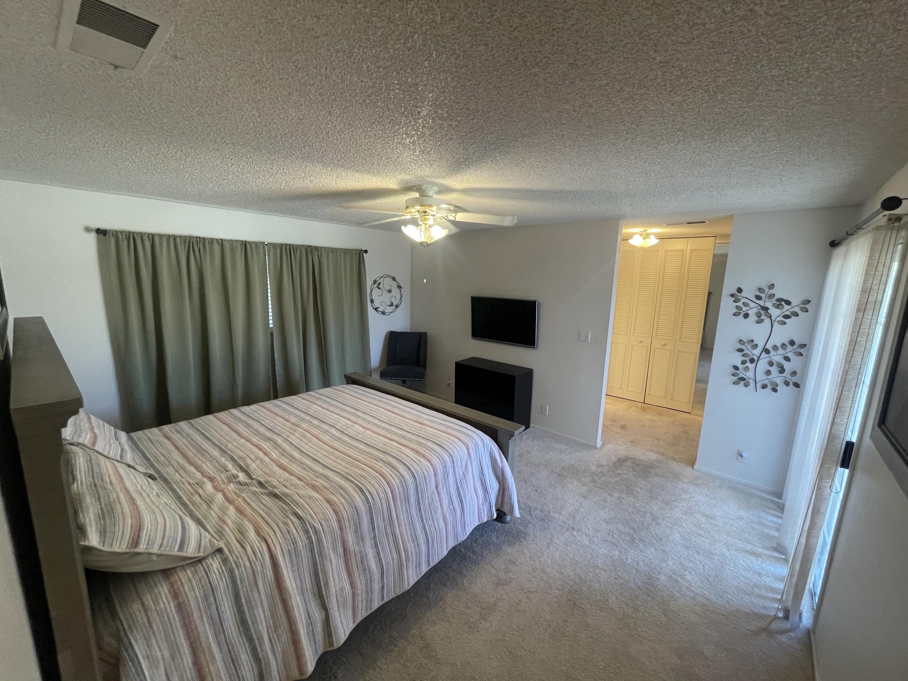 4170 Meander Drive Redding, CA 96001 - Photo 33 of 50 a bedroom with a bed and a flat screen tv