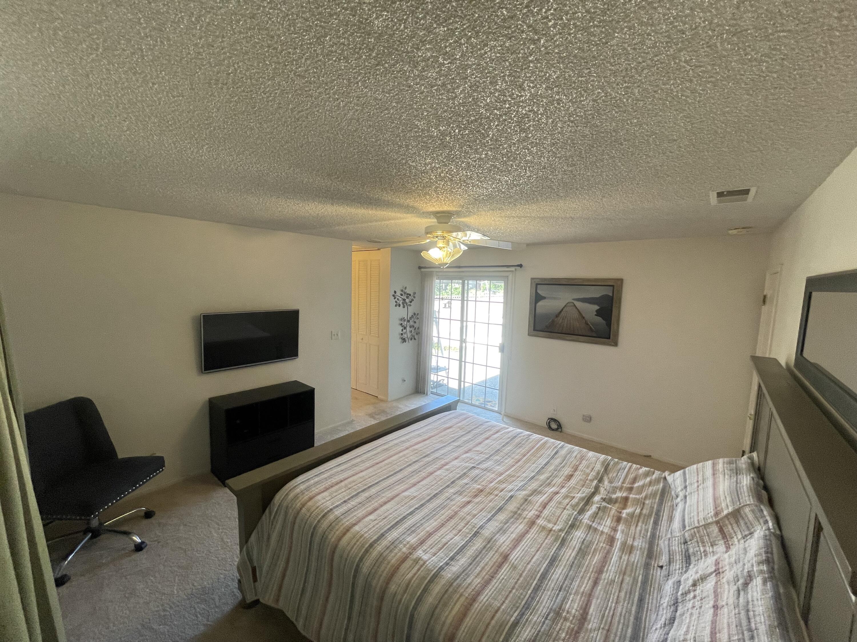 4170 Meander Drive Redding, CA 96001 - Photo 34 of 50 a bedroom with a bed and a television