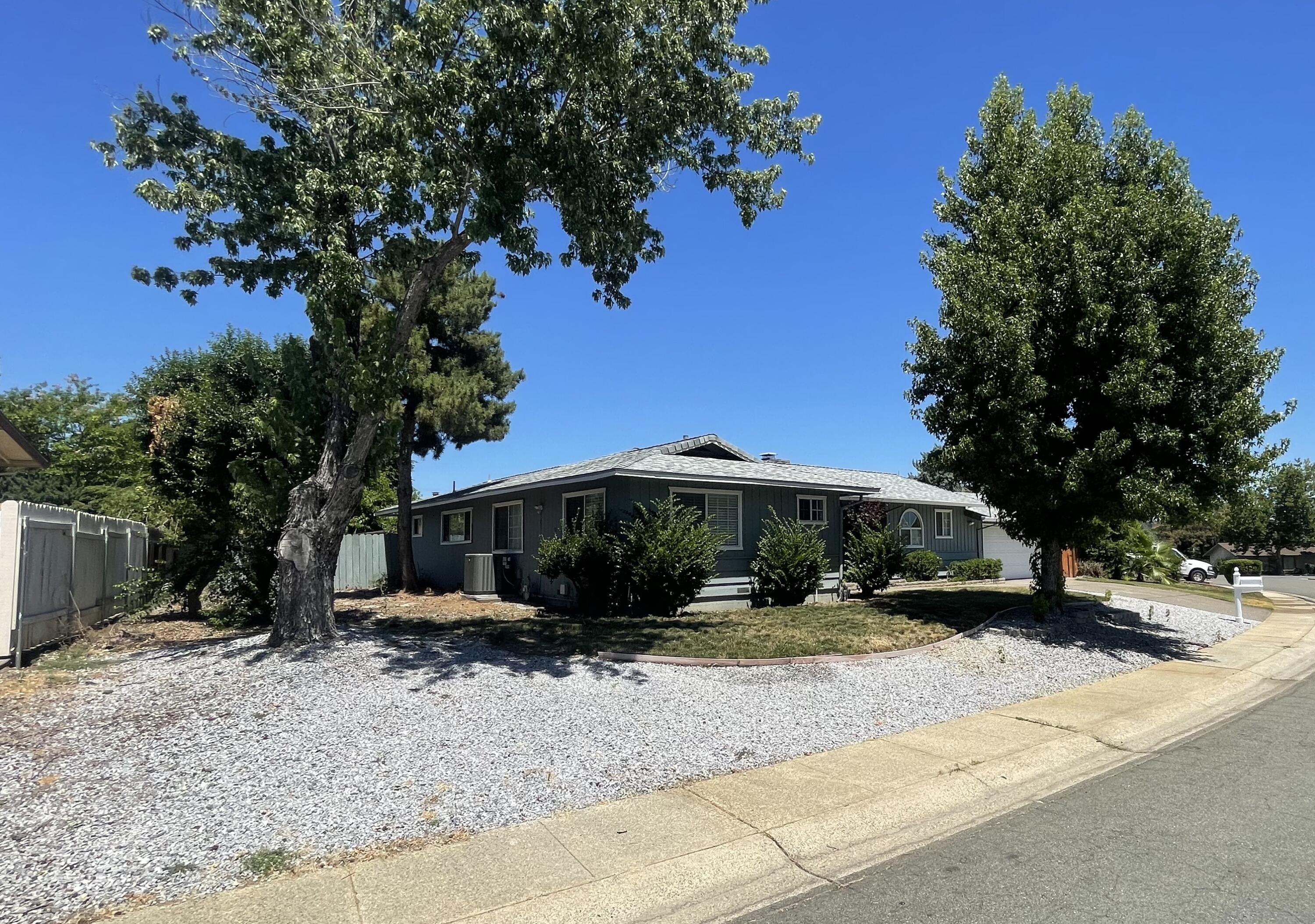 4170 Meander Drive Redding, CA 96001 - Photo 4 of 50 a view of a house with a yard