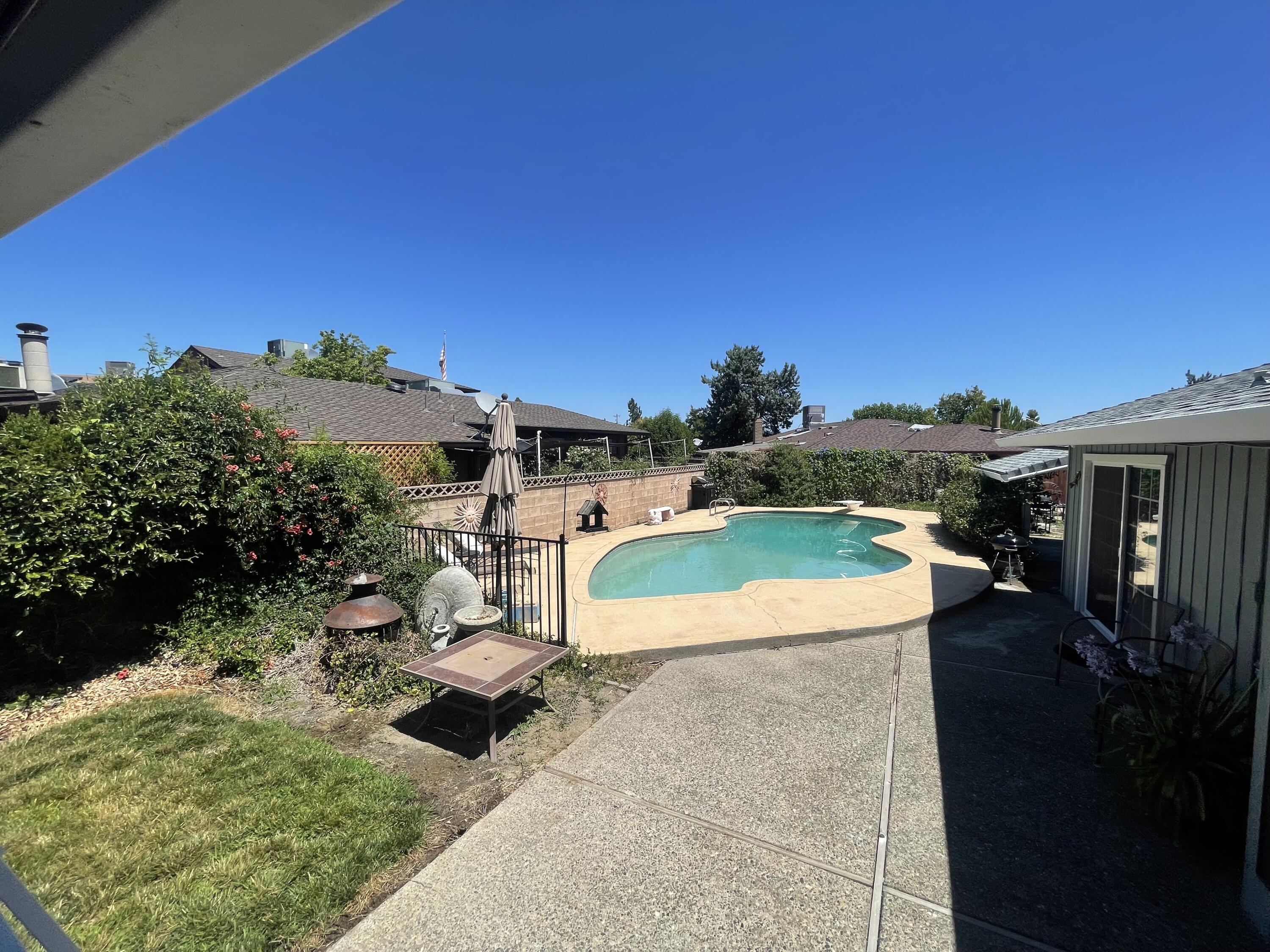 4170 Meander Drive Redding, CA 96001 - Photo 41 of 50 a view of a swimming pool with a yard