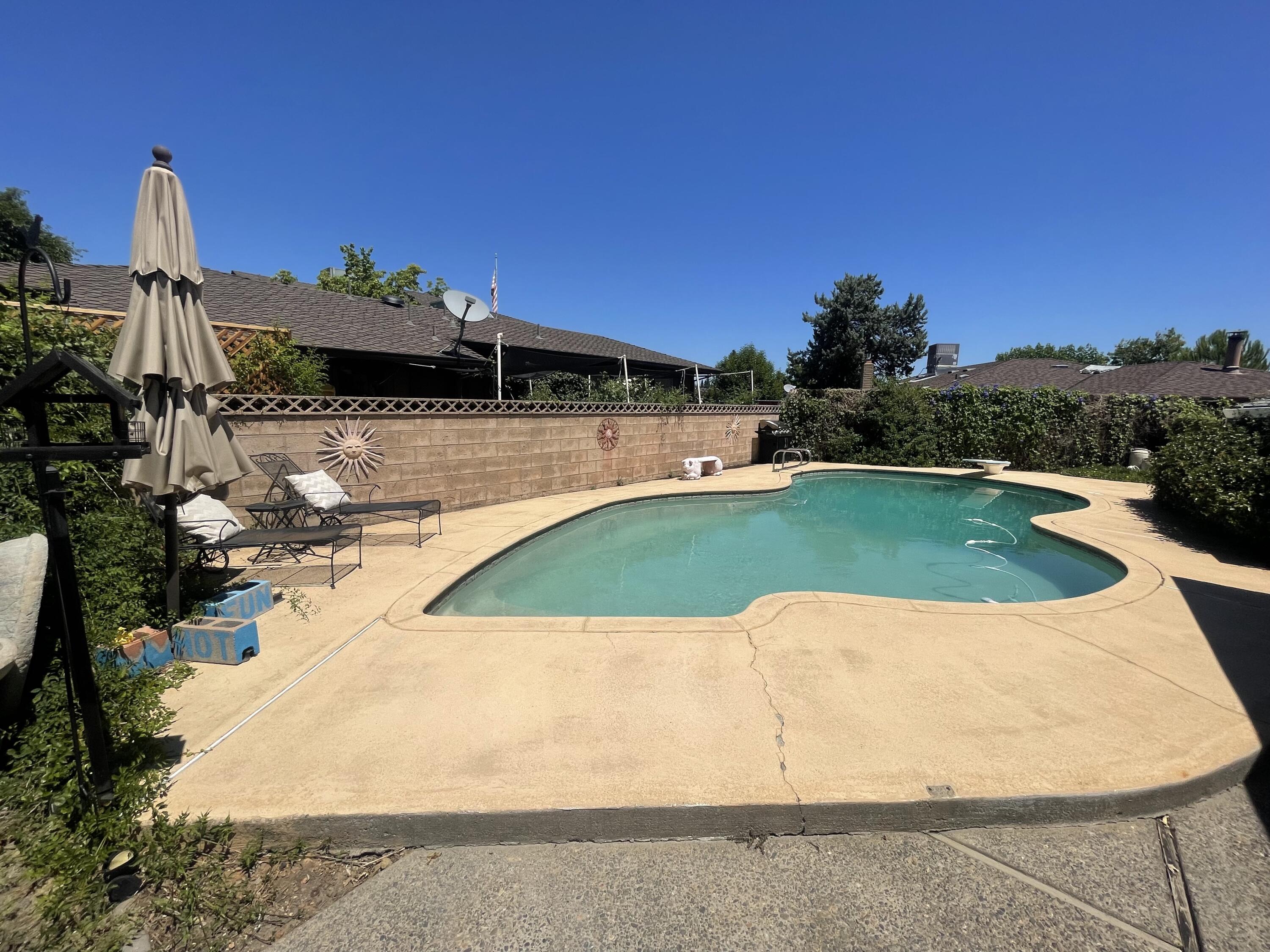 4170 Meander Drive Redding, CA 96001 - Photo 42 of 50 a view of a swimming pool with a yard