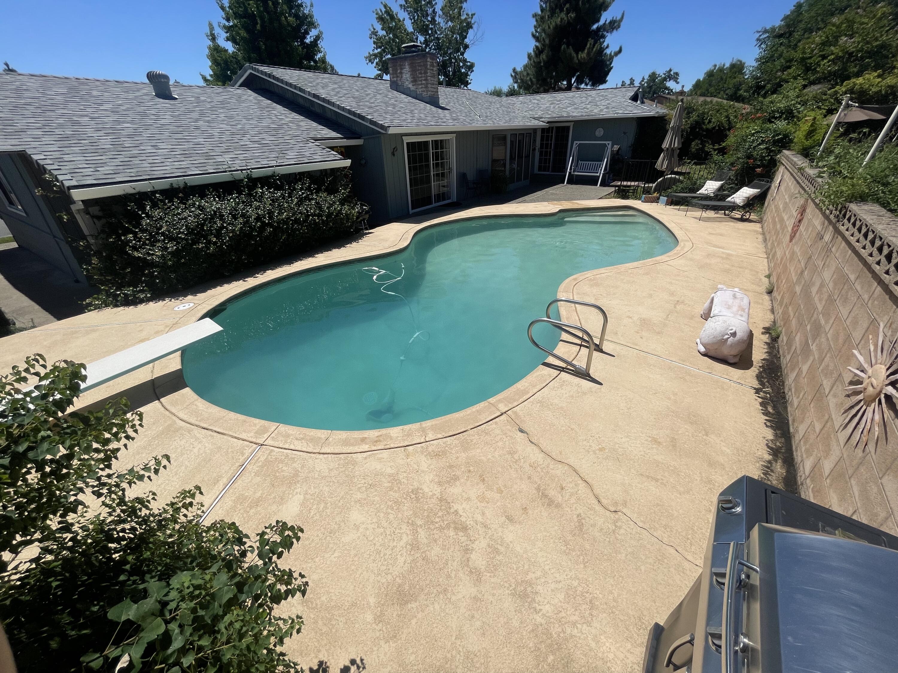 4170 Meander Drive Redding, CA 96001 - Photo 46 of 50 a view of a swimming pool with a patio