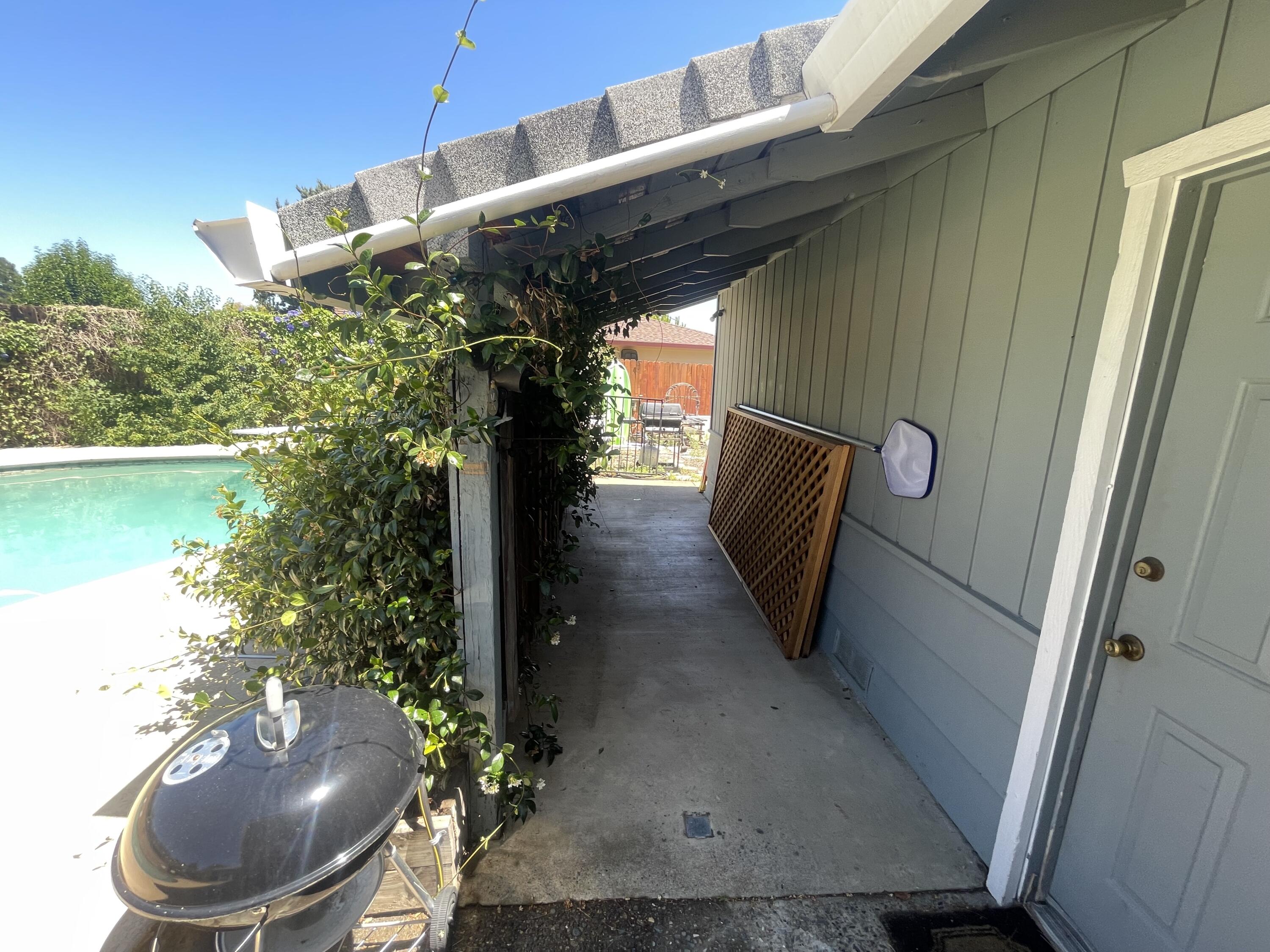 4170 Meander Drive Redding, CA 96001 - Photo 48 of 50 a couple of potted plants in front of door