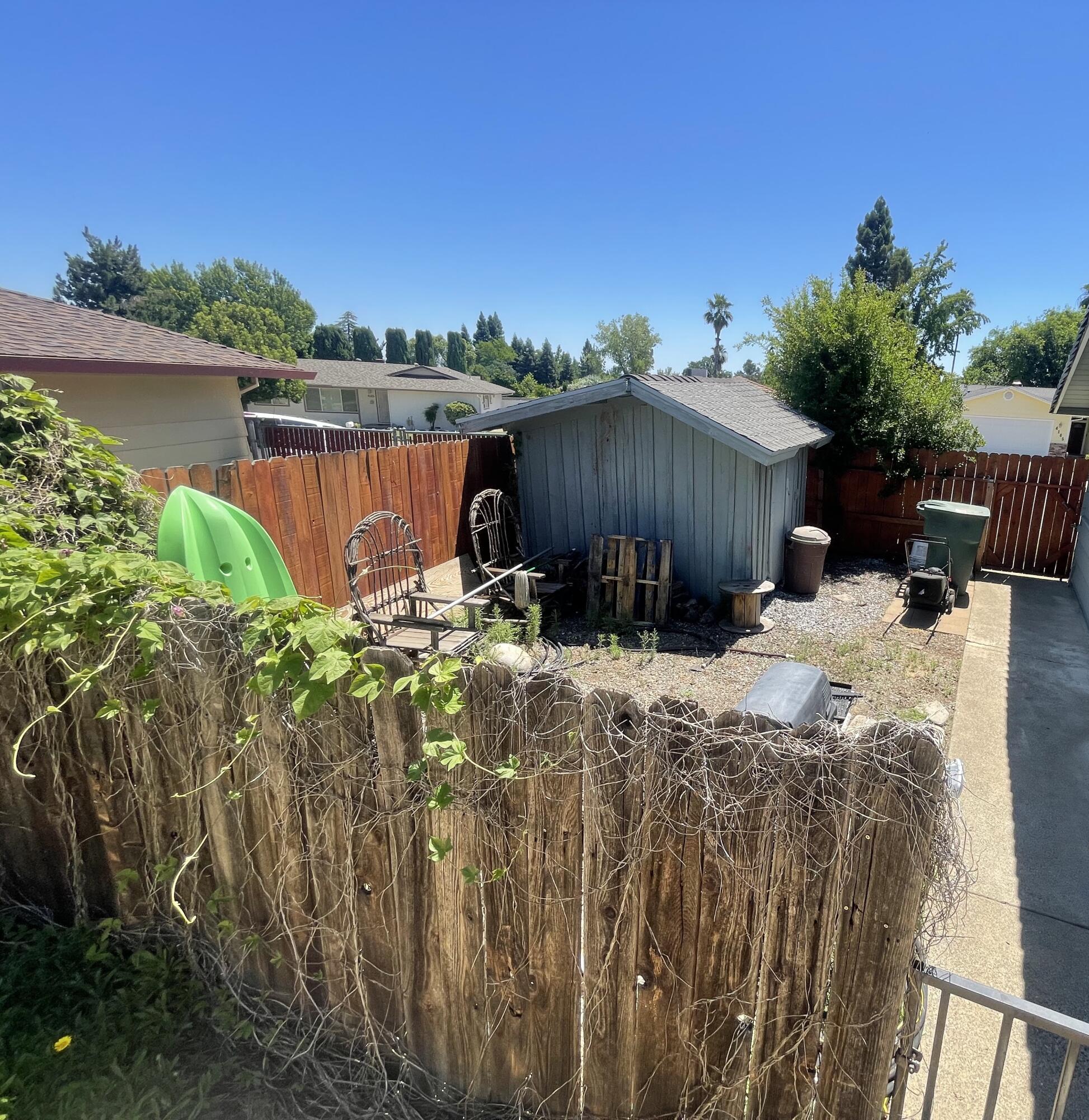 4170 Meander Drive Redding, CA 96001 - Photo 49 of 50 a view of a backyard with plants and a lake