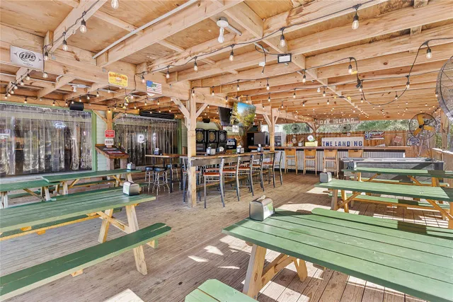 a view of a porch with wooden floor
