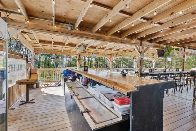 a view of yard with swimming pool and sitting area