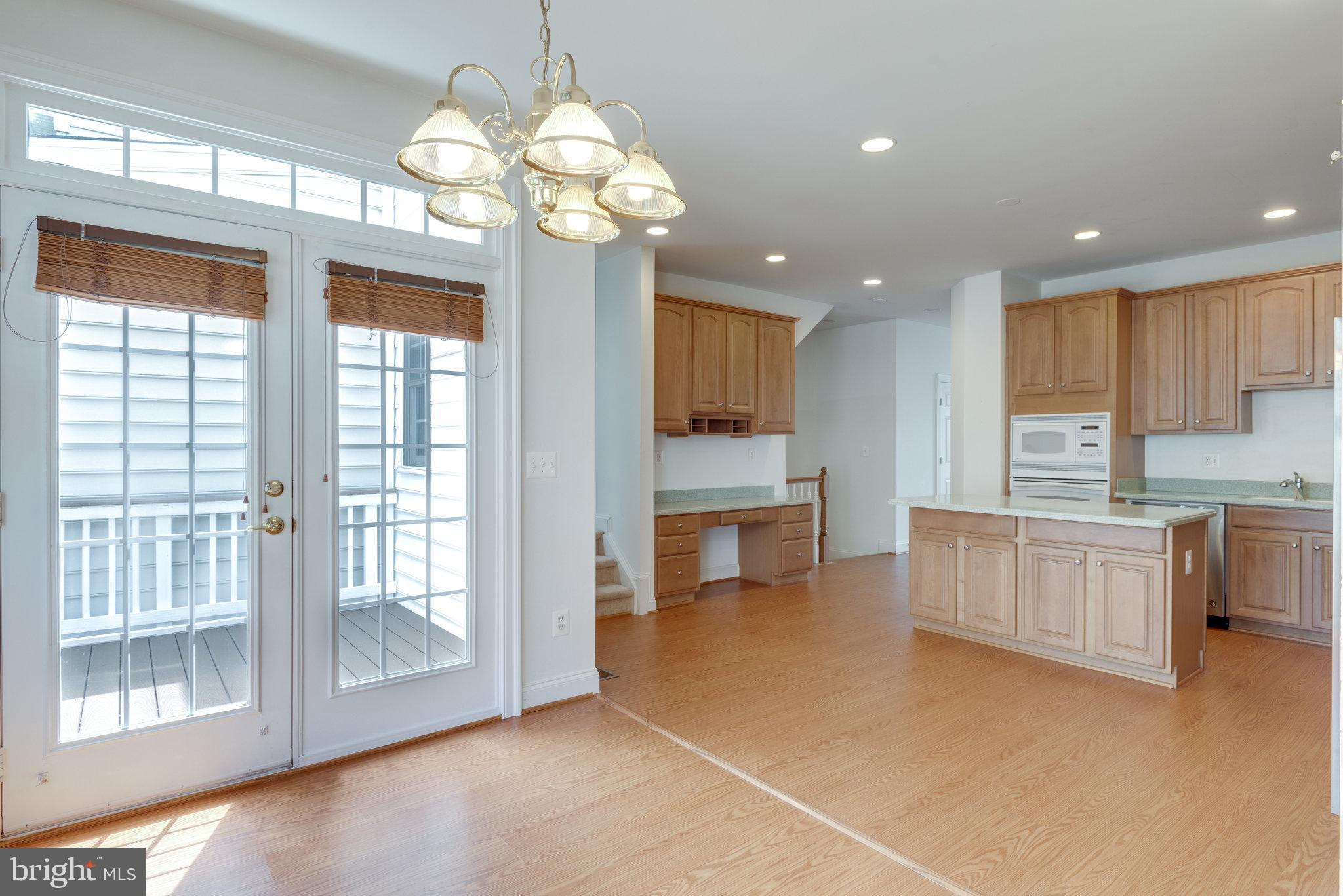 6884 Witton Circle Gainesville, VA 20155 - Photo 14 of 40 a large kitchen with a large window