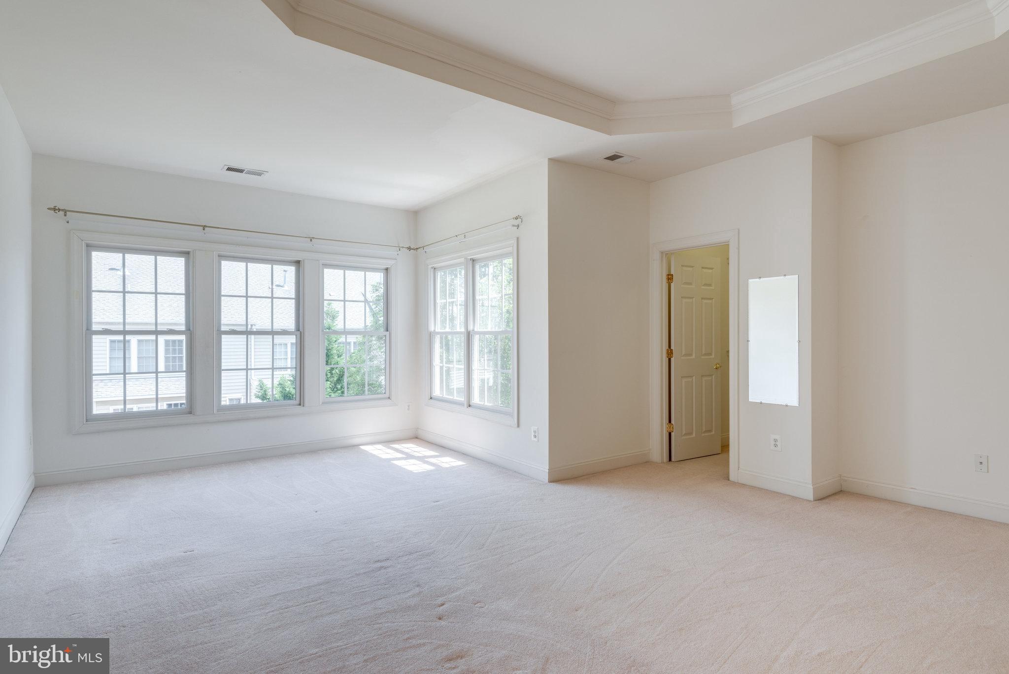 6884 Witton Circle Gainesville, VA 20155 - Photo 16 of 40 a view of an empty room with a window