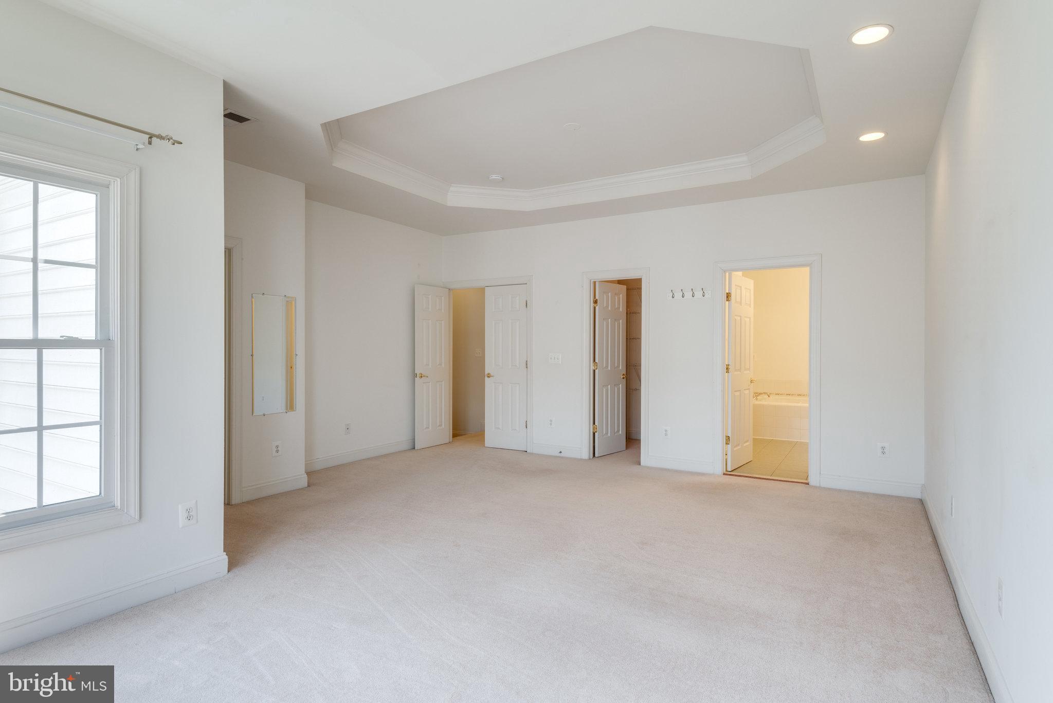 6884 Witton Circle Gainesville, VA 20155 - Photo 18 of 40 an empty room with windows and closet
