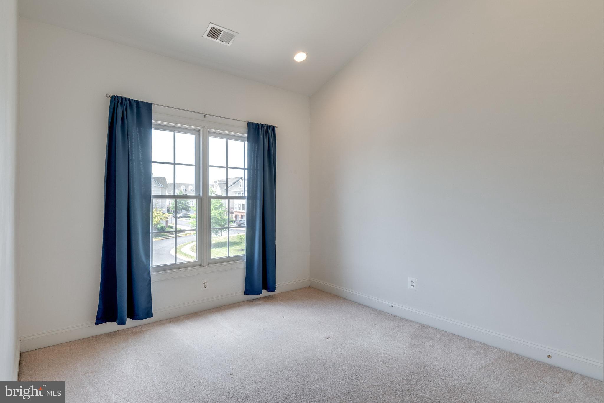 6884 Witton Circle Gainesville, VA 20155 - Photo 22 of 40 a view of an empty room with a window