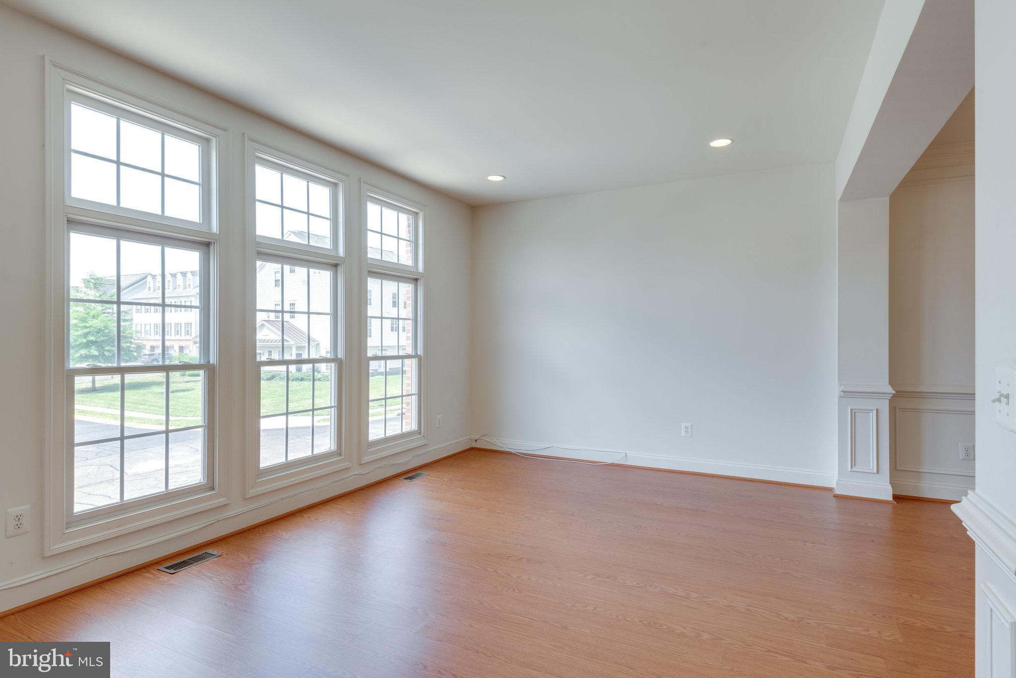 6884 Witton Circle Gainesville, VA 20155 - Photo 3 of 40 wooden floor in an empty room with a window