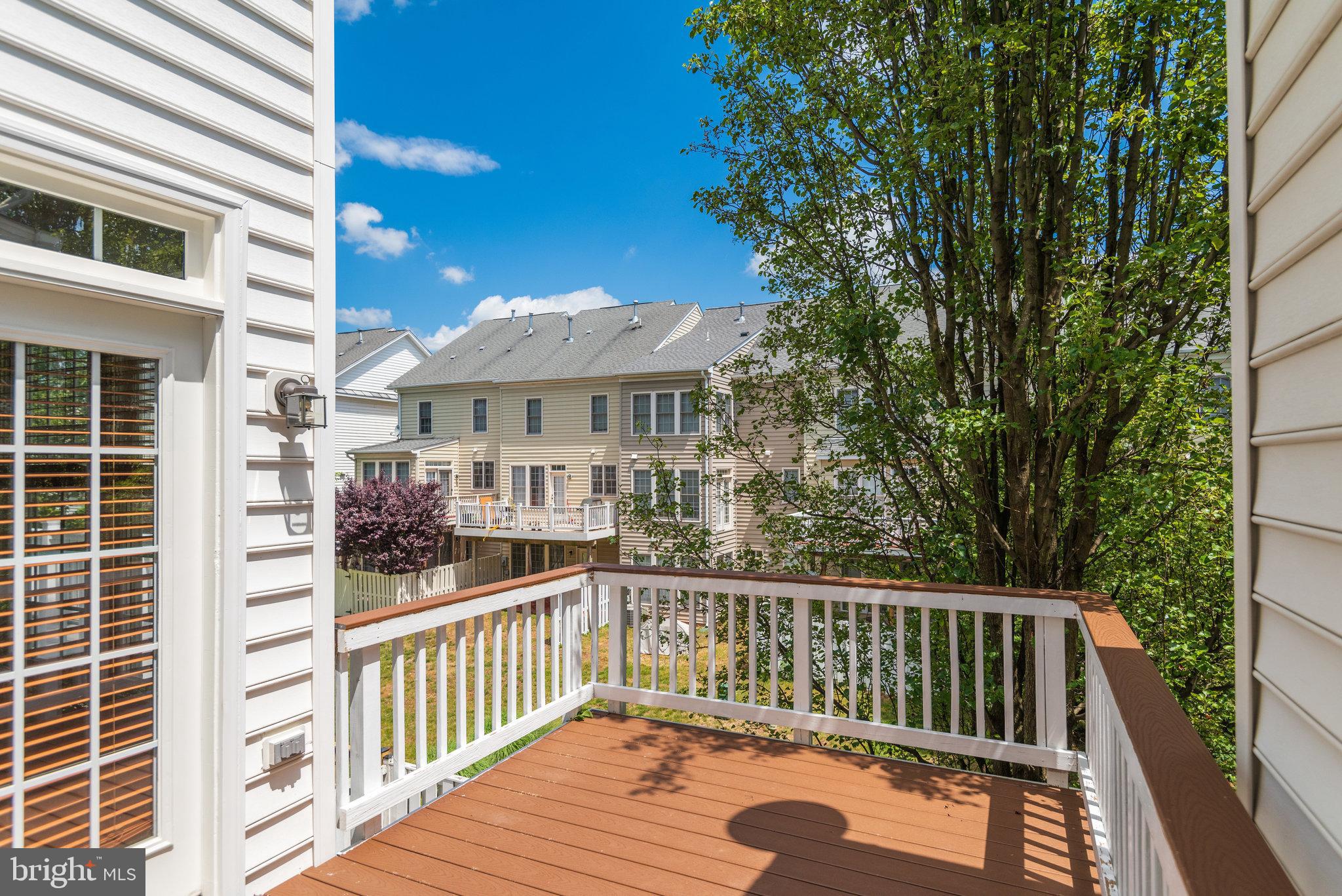 6884 Witton Circle Gainesville, VA 20155 - Photo 32 of 40 a view of a wooden chairs and a table in the balcony
