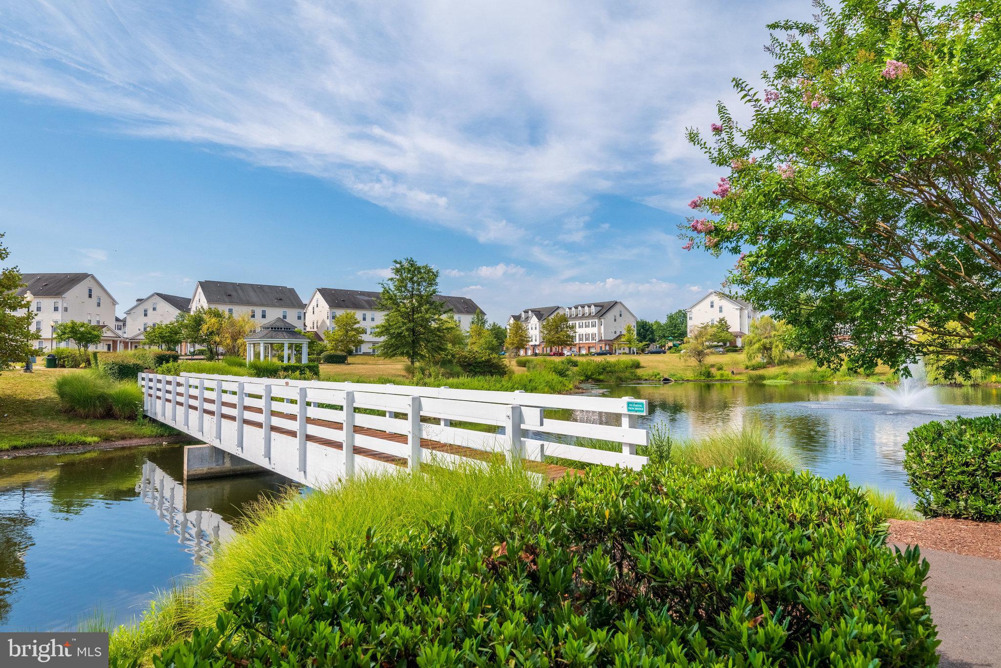 6884 Witton Circle Gainesville, VA 20155 - Photo 40 of 40 a view of a lake with houses in front of it